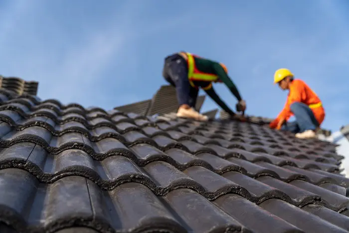 Roofing installation workers on site