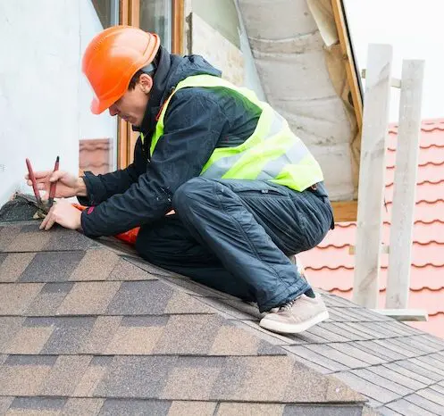 Roof repair professional working safely